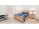 Comfortable bedroom featuring carpeted floors, natural lighting, and simple decor at 11830 Brighton Knoll Loop, Riverview, FL 33579