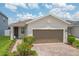 Charming single-Gathering home featuring a well-maintained front yard, two car garage and brick paver driveway at 11830 Brighton Knoll Loop, Riverview, FL 33579