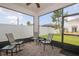 Screened-in patio area with brick flooring and outdoor seating, offering a relaxing outdoor space at 11830 Brighton Knoll Loop, Riverview, FL 33579