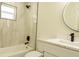 Modern bathroom featuring a tub with tile surround, sleek vanity, and stylish fixtures at 12484 Cross St, Largo, FL 33773