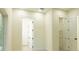 Bright bedroom with neutral walls, wood-look floors, and white doors at 12484 Cross St, Largo, FL 33773