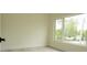 Neutral bedroom featuring a bright window overlooking the outdoors at 12484 Cross St, Largo, FL 33773