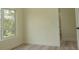 Bright bedroom featuring wood-look floors, a large window with a view, and neutral-colored walls at 12484 Cross St, Largo, FL 33773
