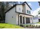 Charming two-story home showcasing a well-maintained lawn and a two-car garage at 12484 Cross St, Largo, FL 33773