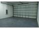 Spacious garage featuring a newly painted epoxy floor and an automatic garage door at 12484 Cross St, Largo, FL 33773