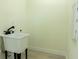 Practical laundry area featuring a utility sink and simple design, offering functionality and convenience at 12484 Cross St, Largo, FL 33773