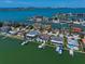 Expansive aerial view of waterfront homes showcasing scenic views of the bay and surrounding community at 14 Sunset Bay Dr, Belleair, FL 33756