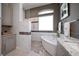 Beautiful bathroom with a glass enclosed shower, soaking tub, and double vanity at 14 Sunset Bay Dr, Belleair, FL 33756