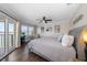 Inviting bedroom with water views, balcony access, and comfortable furnishings at 14 Sunset Bay Dr, Belleair, FL 33756