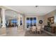 Bright dining area with tiled floors, natural light, and serene water views at 14 Sunset Bay Dr, Belleair, FL 33756