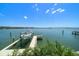 Private boat dock with boat lift and serene waterfront views at 14 Sunset Bay Dr, Belleair, FL 33756