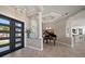 Stunning foyer with tile floors, grand piano, modern lighting, and towering ceilings at 14 Sunset Bay Dr, Belleair, FL 33756