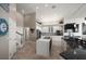 Bright kitchen featuring a large island, stainless steel appliances, and eat-in bar at 14 Sunset Bay Dr, Belleair, FL 33756