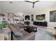 Spacious living room with a cozy sofa and a large entertainment center with TV at 14 Sunset Bay Dr, Belleair, FL 33756