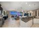 Spacious living area with granite countertops, expansive windows and stunning views of the water at 14 Sunset Bay Dr, Belleair, FL 33756