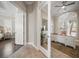 Open entryway into office with custom wood desk, built-in cabinets, and large window at 14 Sunset Bay Dr, Belleair, FL 33756