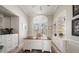 Spacious office with custom built-in cabinets, shelving, and window overlooking exterior at 14 Sunset Bay Dr, Belleair, FL 33756
