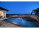 An in-ground pool and hot tub overlooking the water with patio space and landscaping at 14 Sunset Bay Dr, Belleair, FL 33756