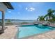 Beautiful waterfront pool and spa with deck and balustrade, offering stunning views at 14 Sunset Bay Dr, Belleair, FL 33756