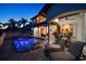A private in-ground pool with outdoor seating and space, overlooking the water at 14 Sunset Bay Dr, Belleair, FL 33756