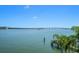 Breathtaking waterfront view showcasing a bridge and the serene open water at 14 Sunset Bay Dr, Belleair, FL 33756