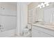 Bathroom featuring a shower/tub combo with a white shower curtain, vanity, and stone countertops at 14313 Eagle Branch Dr, Nokomis, FL 34275