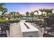 Inviting outdoor fire pit surrounded by comfortable seating, perfect for evening gatherings at 14313 Eagle Branch Dr, Nokomis, FL 34275