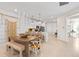 Bright kitchen features modern appliances, island with seating, and open dining area with stylish decor at 14313 Eagle Branch Dr, Nokomis, FL 34275