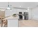 Bright kitchen features a center island, stainless steel appliances, and ample counter space at 14313 Eagle Branch Dr, Nokomis, FL 34275