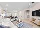 Spacious living area showcases an open layout, seamlessly connecting the kitchen, dining, and living spaces at 14313 Eagle Branch Dr, Nokomis, FL 34275