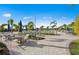 Relaxing pool area with ample seating and lush tropical landscaping for a resort-like experience at 14313 Eagle Branch Dr, Nokomis, FL 34275