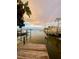 Scenic waterfront view with a rainbow, docks, boats, and calm waters creating a serene and inviting atmosphere at 14555 N Bayshore Dr, Madeira Beach, FL 33708