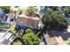 An aerial view shows the back of the home, landscaped backyard, patio, and proximity to neighborhood amenities at 16107 Dawnview Dr, Tampa, FL 33624