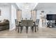 Dining area with modern light fixture, neutral decor and views of the living area at 16107 Dawnview Dr, Tampa, FL 33624