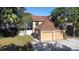 Lovely two-story home featuring a spacious two-car garage and a well-maintained lawn at 16107 Dawnview Dr, Tampa, FL 33624