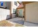 Front entrance featuring a light blue door, small porch and garden space with a white fence at 16107 Dawnview Dr, Tampa, FL 33624