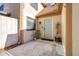 Front entrance featuring a light blue door, small porch and garden space with a white fence at 16107 Dawnview Dr, Tampa, FL 33624