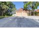 Attached two-car garage with a wide driveway and mature landscaping in a suburban neighborhood at 16107 Dawnview Dr, Tampa, FL 33624