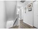 Hallway with vinyl floors and unique wall decor and access to an open doorway at 16107 Dawnview Dr, Tampa, FL 33624