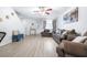 Spacious living room boasts wood floors, neutral walls, comfortable sofas, and a staircase at 16107 Dawnview Dr, Tampa, FL 33624