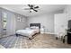 Comfortable main bedroom with light gray walls and light-filled windows at 16107 Dawnview Dr, Tampa, FL 33624