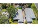 An aerial view of a single-Gathering home featuring a well-maintained roof and tidy landscaping at 1710 Shore Acres Ne Blvd, St Petersburg, FL 33703