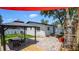 Spacious backyard with patio, dining gazebo, privacy fence, and a soaking tub spa at 1710 Shore Acres Ne Blvd, St Petersburg, FL 33703