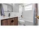 Beautiful bathroom features a sink with stylish vanity and a tiled shower at 1710 Shore Acres Ne Blvd, St Petersburg, FL 33703