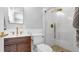 Bathroom features a sleek vanity, modern fixtures, and a glass shower at 1710 Shore Acres Ne Blvd, St Petersburg, FL 33703
