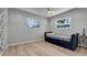 Bedroom with hardwood floors, neutral walls and an accent wall decor at 1710 Shore Acres Ne Blvd, St Petersburg, FL 33703