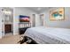 Bedroom features hardwood flooring, soft walls and views to the bathroom at 1710 Shore Acres Ne Blvd, St Petersburg, FL 33703