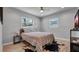 Bedroom boasts wood flooring, soft neutral walls, and natural light at 1710 Shore Acres Ne Blvd, St Petersburg, FL 33703