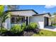 Charming front exterior with well-maintained landscaping and an inviting entrance at 1710 Shore Acres Ne Blvd, St Petersburg, FL 33703