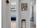 Hallway view of bedroom and bathroom with neutral colors at 1710 Shore Acres Ne Blvd, St Petersburg, FL 33703